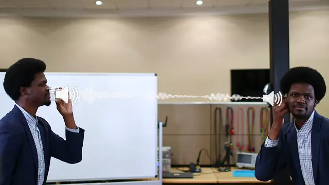 The instructor shown twice, speaking into one cup and listening at the other, the sound drawn along the string between them.